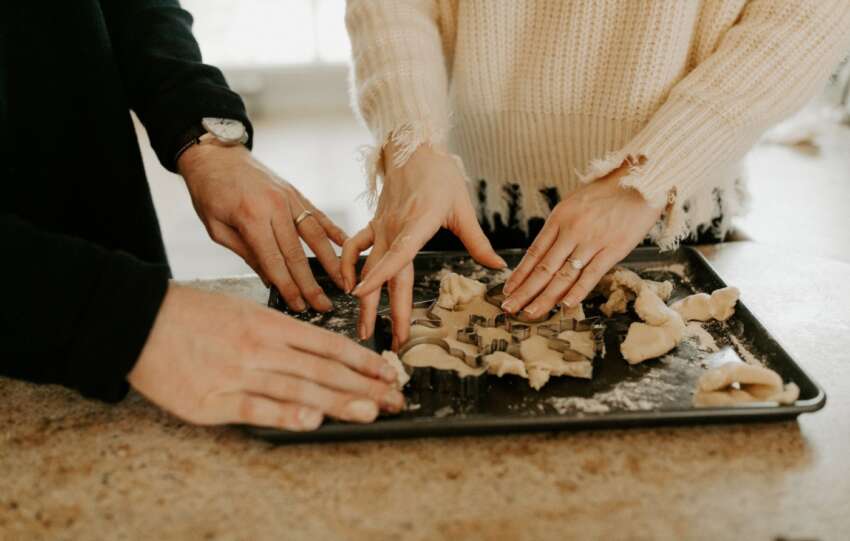 couple making holiday cookies