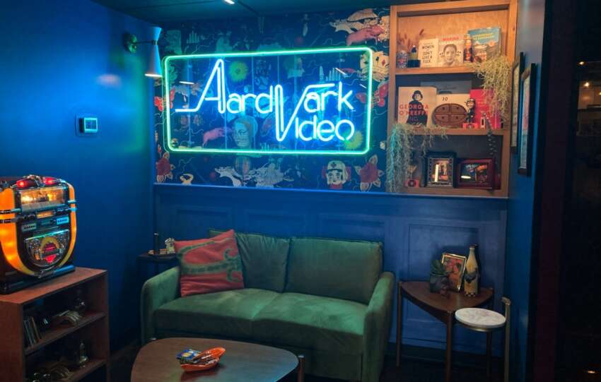 bar interior with green couch and neon lights