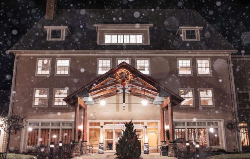 snowy lodge decorated for christmas