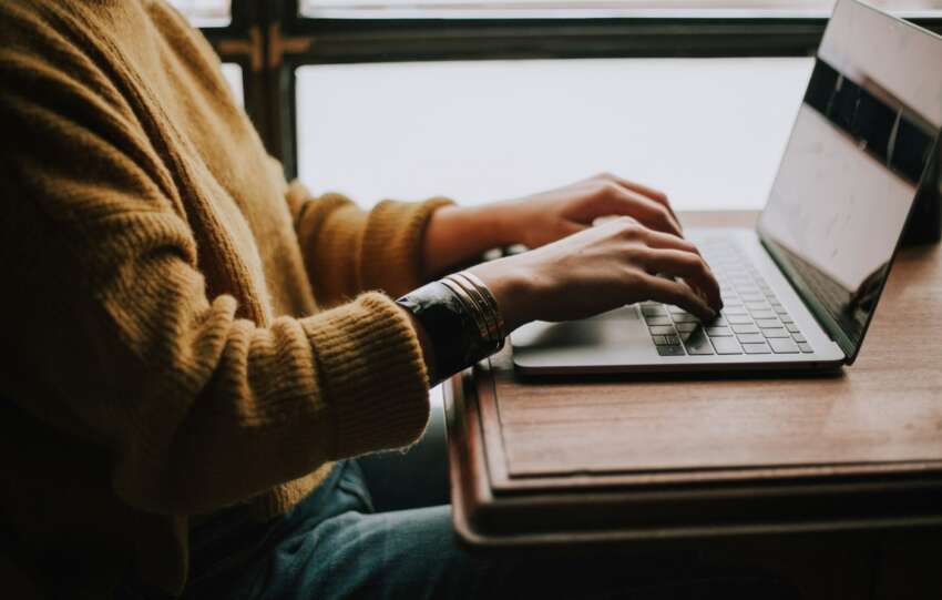 person typing on computer
