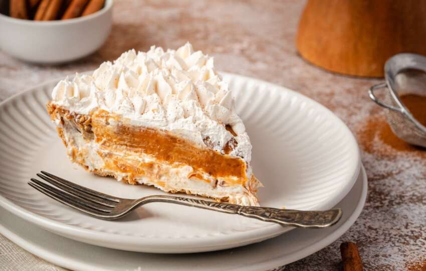 a slice of pumpkin pie cheesecake on plate