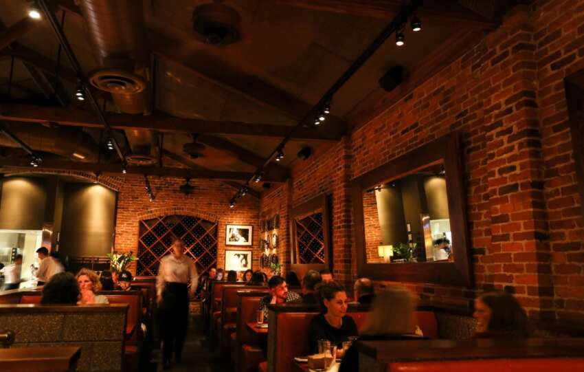 romantic restaurant with exposed brick and wood beams